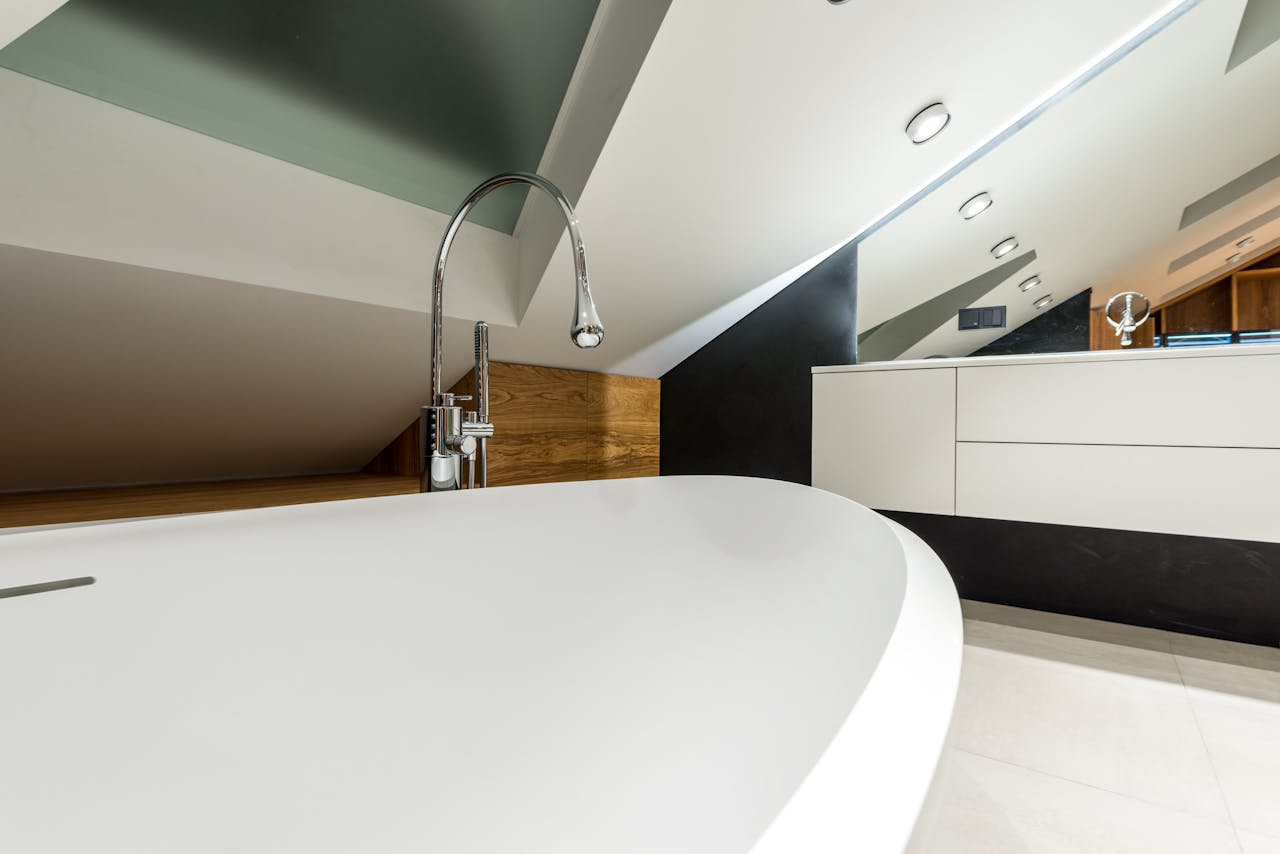 Elegant contemporary bathroom featuring a freestanding bathtub and sleek design elements.